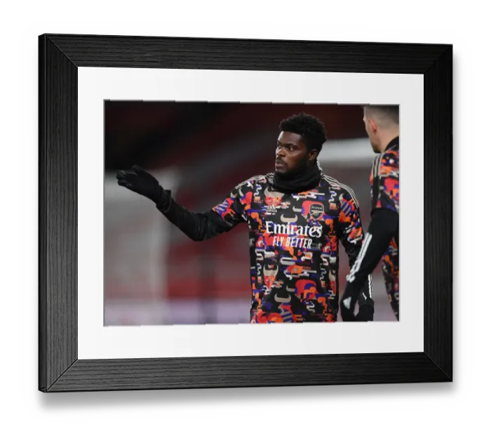 Framed Print : Thomas Partey Prepares: Arsenal vs Manchester United (Empty Emirates, 2021)