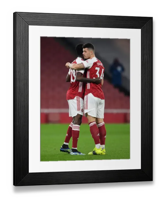 Framed Print : Arsenal's Partey and Xhaka Before Empty Emirates: Arsenal v Manchester United, 2021-22 Premier League