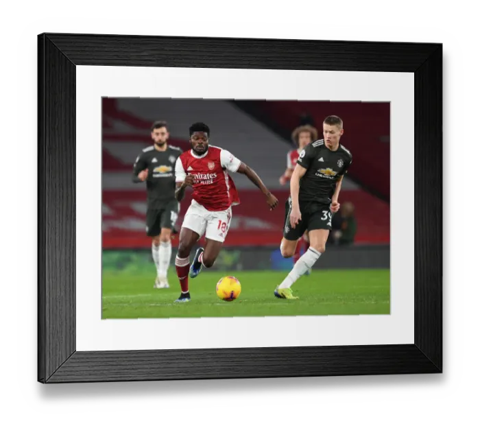 Framed Print : Intense Rivalry: Partey vs McTominay Clash in Empty Arsenal vs Manchester United Premier League Match, 2021 Framed Print : Intense Rivalry: Partey vs McTominay Clash in Empty Arsenal vs Manchester United Premier League Match, 2021