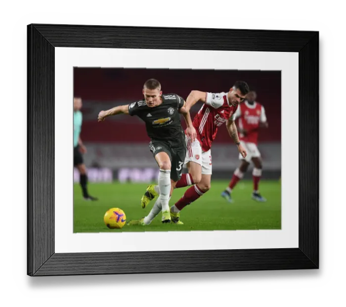 Framed Print : Xhaka's Defiant Shut-Down: Empty Emirates Silent as Arsenal Star Stifles McTominay Framed Print : Xhaka's Defiant Shut-Down: Empty Emirates Silent as Arsenal Star Stifles McTominay