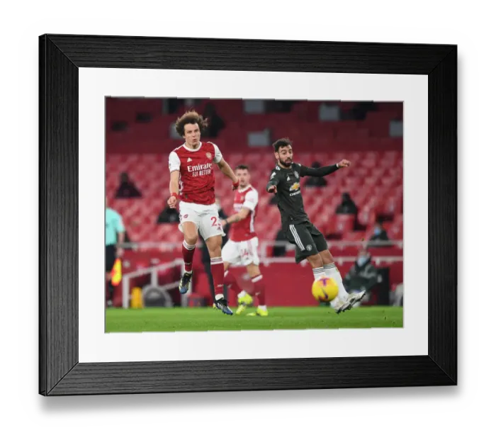 Framed Print : Arsenal vs Manchester United: David Luiz Shoots Under Pressure in Empty Emirates Stadium, Premier League 2020-21