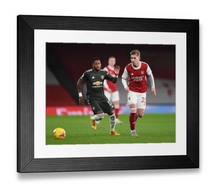 Framed Print : Emile Smith Rowe Stands Firm Against Fred: Arsenal vs Manchester United at Empty Emirates (Premier League 2020-21)