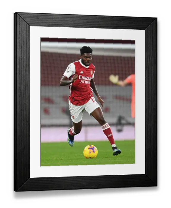Framed Print : Thomas Partey in Action: Arsenal vs Manchester United (2020-21) - Emirates Stadium under COVID-19 Restrictions