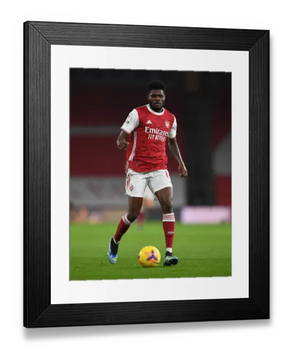 Framed Print : Thomas Partey: Arsenal Star Shines at Empty Emirates Against Manchester United (Premier League 2021) Framed Print : Thomas Partey: Arsenal Star Shines at Empty Emirates Against Manchester United (Premier League 2021)
