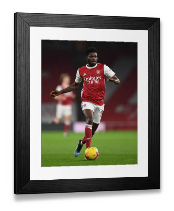 Framed Print : Thomas Partey in Action: Arsenal vs Manchester United (2020-21) - Emirates Stadium During Pandemic Restrictions