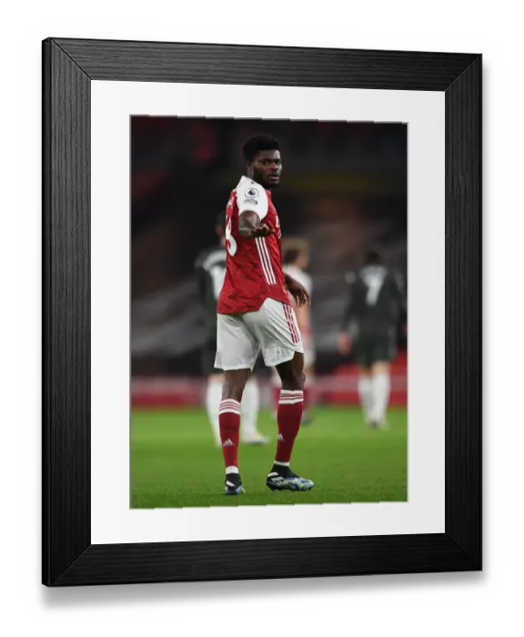 Framed Print : Arsenal vs Manchester United: Thomas Partey in Action at Emirates Stadium during the 2021-22 Premier League Match (Behind Closed Doors) Framed Print : Arsenal vs Manchester United: Thomas Partey in Action at Emirates Stadium during the 2021-22 Premier League Match (Behind Closed Doors)