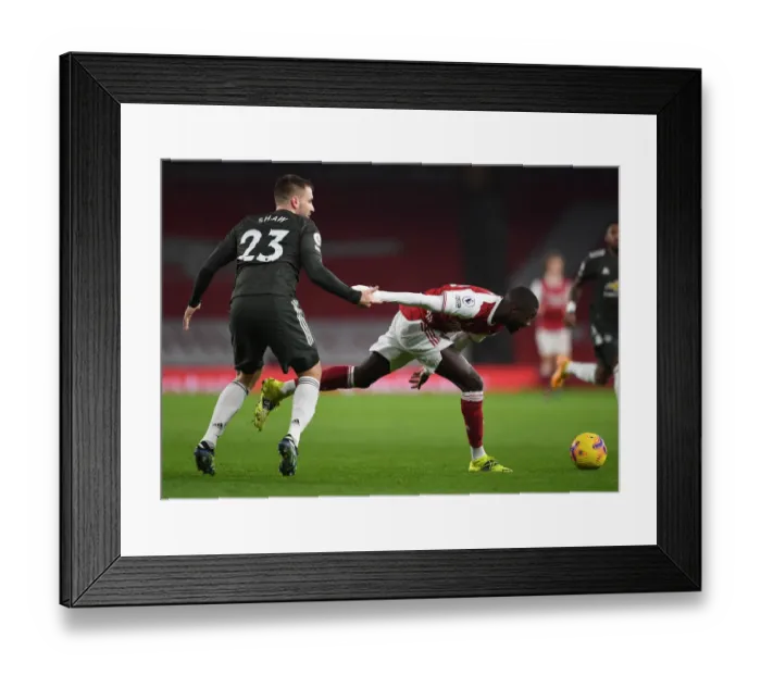 Framed Print : Pepe vs Shaw: Premier League Showdown at Empty Emirates Stadium - Arsenal vs Manchester United 2021 Framed Print : Pepe vs Shaw: Premier League Showdown at Empty Emirates Stadium - Arsenal vs Manchester United 2021