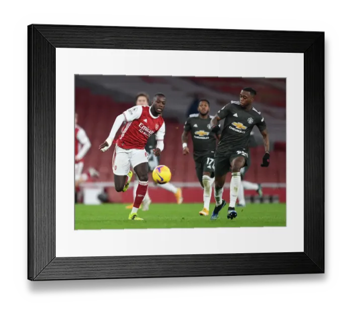 Framed Print : Arsenal vs Manchester United: Pepe vs Wan-Bissaka Clash in Empty Emirates Stadium (Premier League 2020-21)