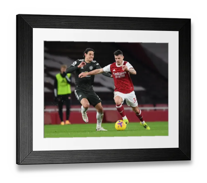 Framed Print : Arsenal vs Manchester United: Granit Xhaka vs Edinson Cavani Clash in Empty Emirates Stadium, Premier League 2020-21 Framed Print : Arsenal vs Manchester United: Granit Xhaka vs Edinson Cavani Clash in Empty Emirates Stadium, Premier League 2020-21