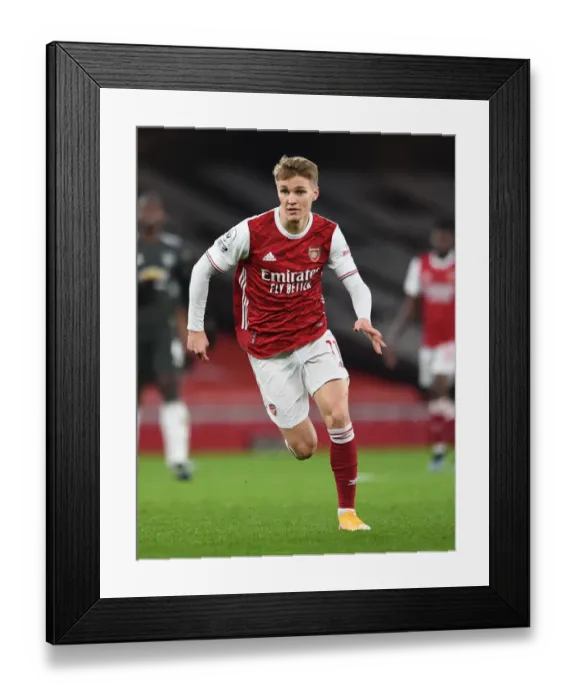 Framed Print : Arsenal vs Manchester United: Emirates Stadium Showdown in Empty Premier League Match (2021)