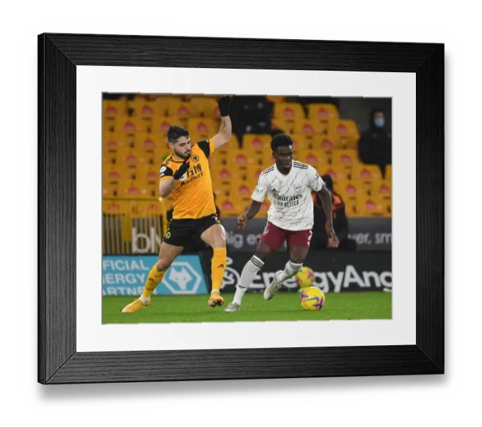 Framed Print : Bukayo Saka vs Pedro Neto: Intense Battle at Molineux - Wolverhampton Wanderers vs Arsenal, Premier League 2020-21