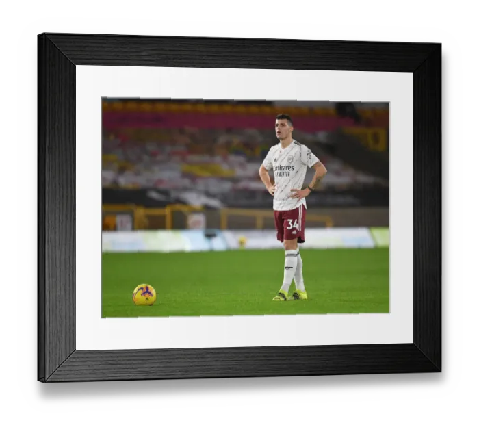 Framed Print : Granit Xhaka's Brilliant Midfield Performance: Arsenal Triumph Over Wolverhampton Wanderers