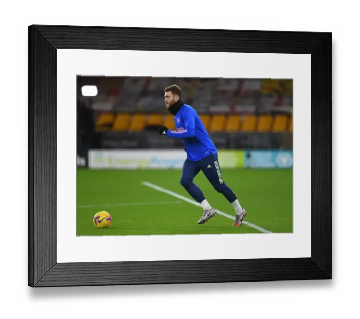 Framed Print : Calum Chambers: Arsenal's Focused Pre-Match Warm-Up Ahead of Wolverhampton Wanderers Clash