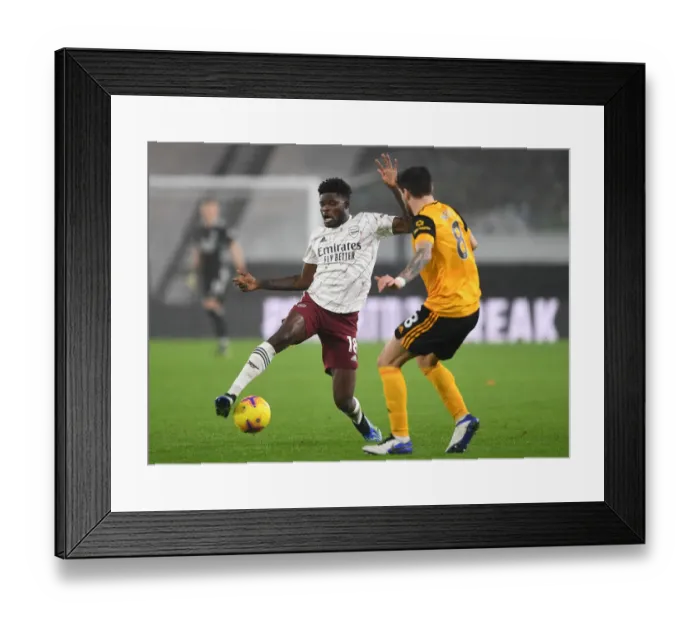 Framed Print : Thomas Partey vs. Ruben Neves: Battle in the Midfield - Wolverhampton Wanderers vs. Arsenal, Premier League 2020-21