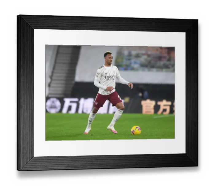 Framed Print : Gabriel Magalhaes Focuses in Arsenal's Battle at Molineux: Wolverhampton Wanderers vs Arsenal, Premier League 2020-21