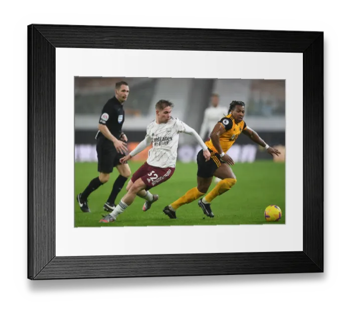 Framed Print : Wolverhampton Wanderers vs Arsenal: Intense Battle between Emile Smith Rowe and Adama Traore in the Premier League
