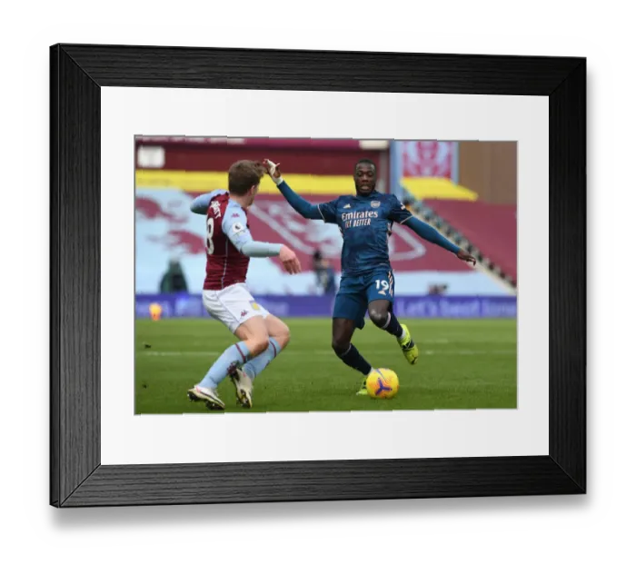 Framed Print : Pepe vs Targett: Intense Battle in Aston Villa vs Arsenal Premier League Clash
