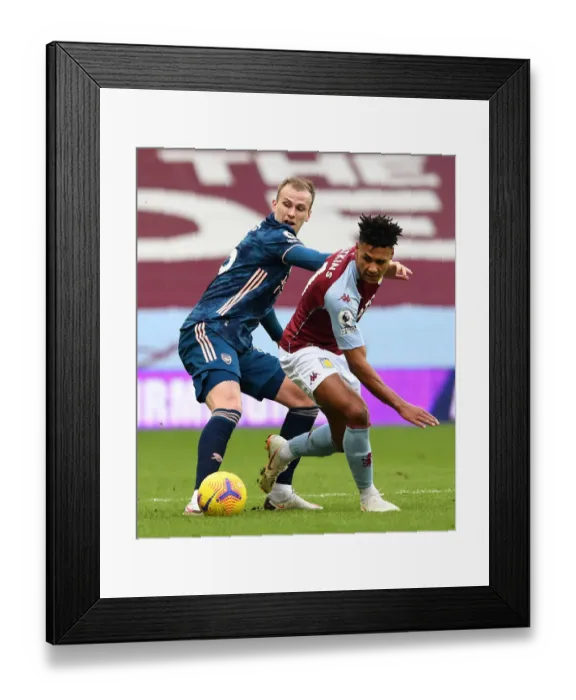 Framed Print : Arsenal's Rob Holding Shuts Down Ollie Watkins in Aston Villa vs Arsenal Premier League Clash Framed Print : Arsenal's Rob Holding Shuts Down Ollie Watkins in Aston Villa vs Arsenal Premier League Clash