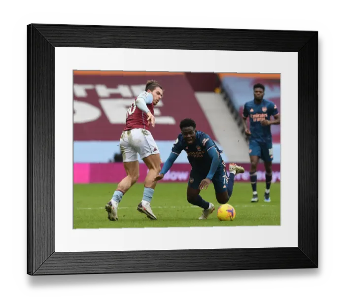 Framed Print : Aston Villa vs Arsenal: Bukayo Saka Fouled by Jack Grealish in Intense Premier League Clash Framed Print : Aston Villa vs Arsenal: Bukayo Saka Fouled by Jack Grealish in Intense Premier League Clash