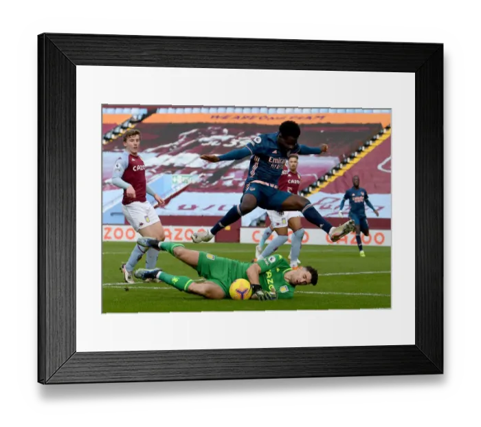 Framed Print : Saka vs Martinez: A Footballing Battle in the Aston Villa vs Arsenal Premier League Clash