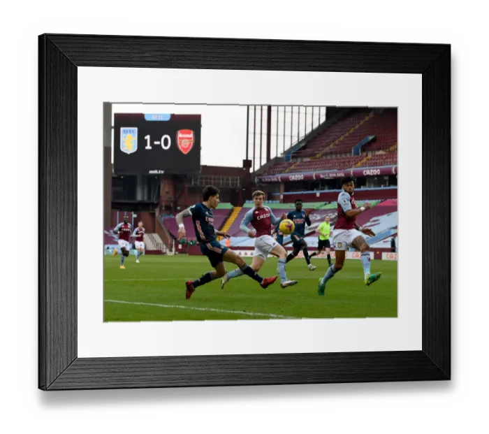 Framed Print : Hector Bellerin Faces Pressure from Villa Defenders During Arsenal's Premier League Clash