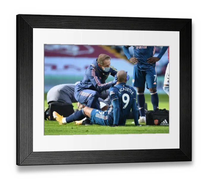 Framed Print : Arsenal's Alex Lacazette Receives Treatment from Physio during Aston Villa vs Arsenal (Behind Closed Doors) Framed Print : Arsenal's Alex Lacazette Receives Treatment from Physio during Aston Villa vs Arsenal (Behind Closed Doors)