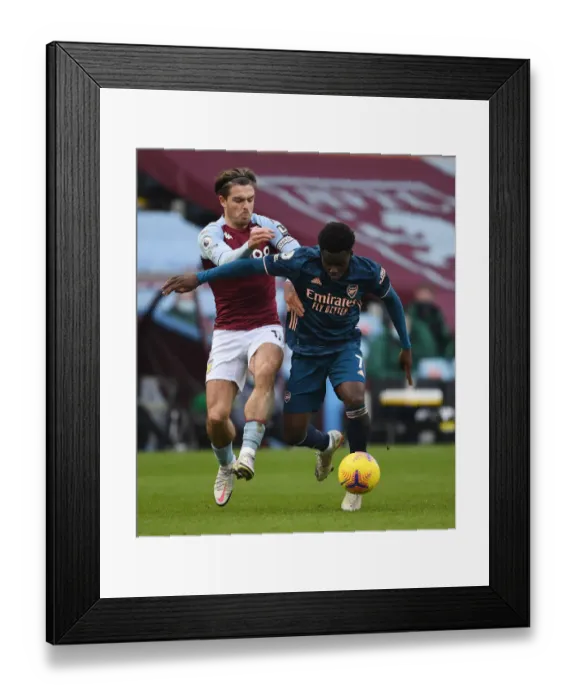 Framed Print : Bukayo Saka vs Jack Grealish: A Battle at Villa Park in Empty Premier League Stadiums (Aston Villa v Arsenal, 2021) Framed Print : Bukayo Saka vs Jack Grealish: A Battle at Villa Park in Empty Premier League Stadiums (Aston Villa v Arsenal, 2021)