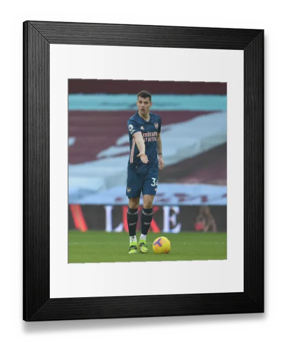 Framed Print : Granit Xhaka: Arsenal's Midfield Maestro Shines in Empty Villa Park during Premier League 2020-21 Match vs. Aston Villa