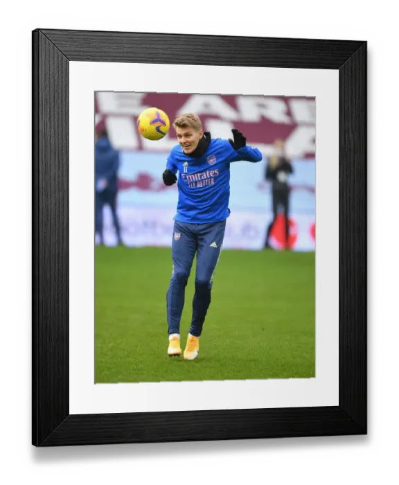 Framed Print : Arsenal's Martin Odegaard Prepares for Aston Villa Clash in Empty Villa Park (Aston Villa vs Arsenal, 2021-22 Premier League)