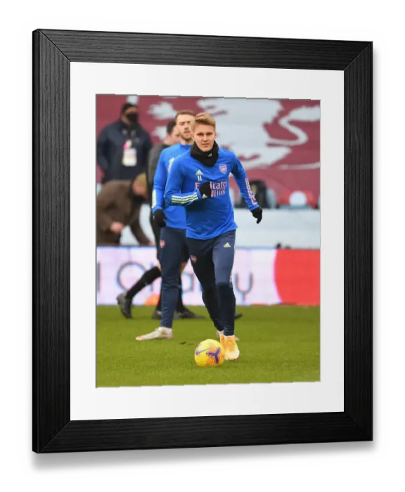 Framed Print : Martin Odegaard Prepares for Aston Villa Showdown in Empty Villa Park (Premier League 2021-22) Framed Print : Martin Odegaard Prepares for Aston Villa Showdown in Empty Villa Park (Premier League 2021-22)