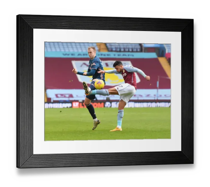 Framed Print : Arsenal's Rob Holding Blocks Aston Villa's Mahmoud Trezeguet: A Premier League Clash Amidst COVID-19 Restrictions