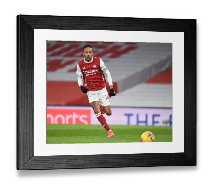 Framed Print : Arsenal's Aubameyang Goes Head-to-Head with Leeds United in Premier League Battle