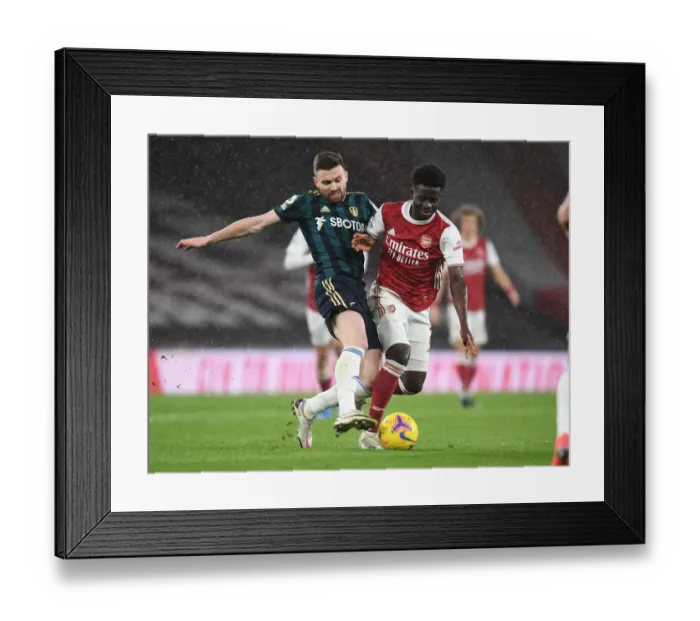 Framed Print : Arsenal vs Leeds United: Bukayo Saka Clashes with Stuart Dallas in Premier League Showdown Framed Print : Arsenal vs Leeds United: Bukayo Saka Clashes with Stuart Dallas in Premier League Showdown