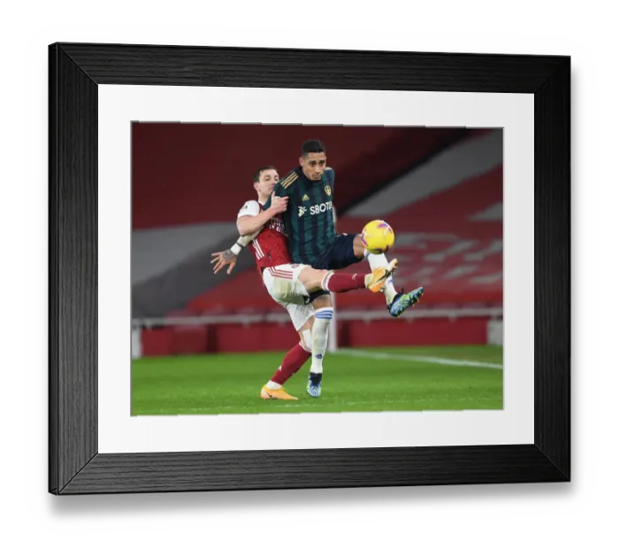 Framed Print : Intense Battle: Arsenal vs Leeds United, Premier League 2020-21 - Arsenal's Cedric Clashes with Leeds Raphinha at Emirates Stadium Framed Print : Intense Battle: Arsenal vs Leeds United, Premier League 2020-21 - Arsenal's Cedric Clashes with Leeds Raphinha at Emirates Stadium