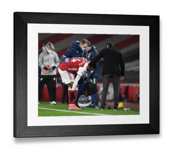 Framed Print : Arsenal: Mikel Arteta Tends to Injured Aubameyang Amid Leeds United Clash