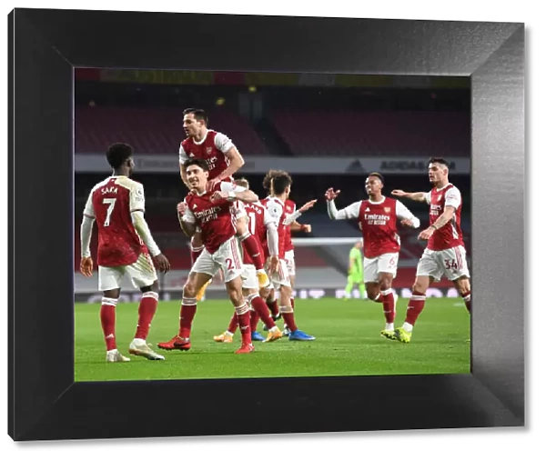 Arsenal's Bellerin, Saka, and Cedric: Celebrating a Triumphant Three-Goal Spree Against Leeds United in the Premier League, 2021