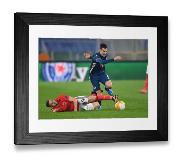 Framed Print : Dani Ceballos Breaks Past Adel Taarabt: Arsenal vs. SL Benfica - UEFA Europa League Round of 32, Rome, Italy Framed Print : Dani Ceballos Breaks Past Adel Taarabt: Arsenal vs. SL Benfica - UEFA Europa League Round of 32, Rome, Italy