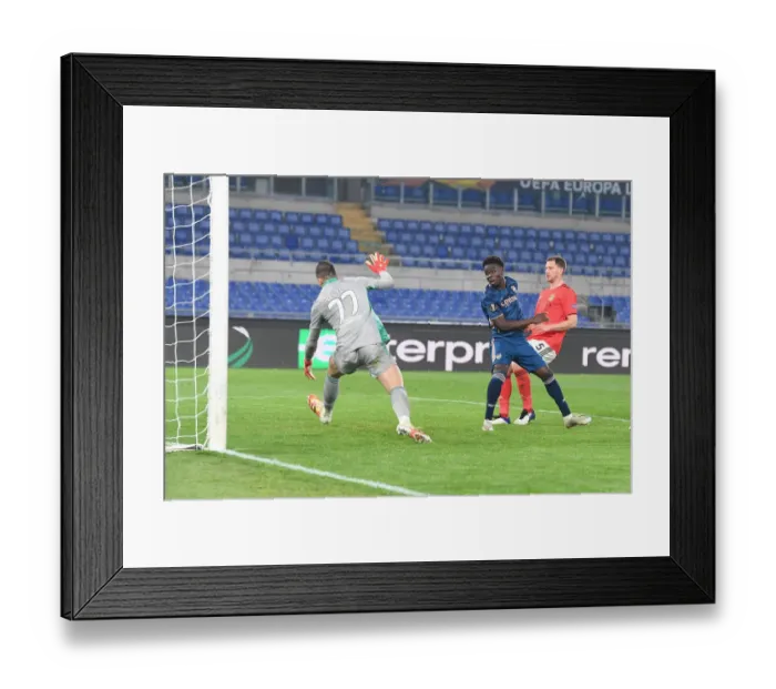 Framed Print : Bukayo Saka Scores the Winner: Arsenal Triumphs Over SL Benfica in Europa League Round of 32 Framed Print : Bukayo Saka Scores the Winner: Arsenal Triumphs Over SL Benfica in Europa League Round of 32