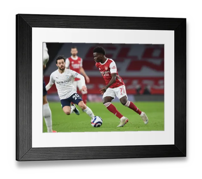 Framed Print : Saka vs Silva: Premier League Showdown at Empty Emirates Stadium - Arsenal vs Manchester City, 2021