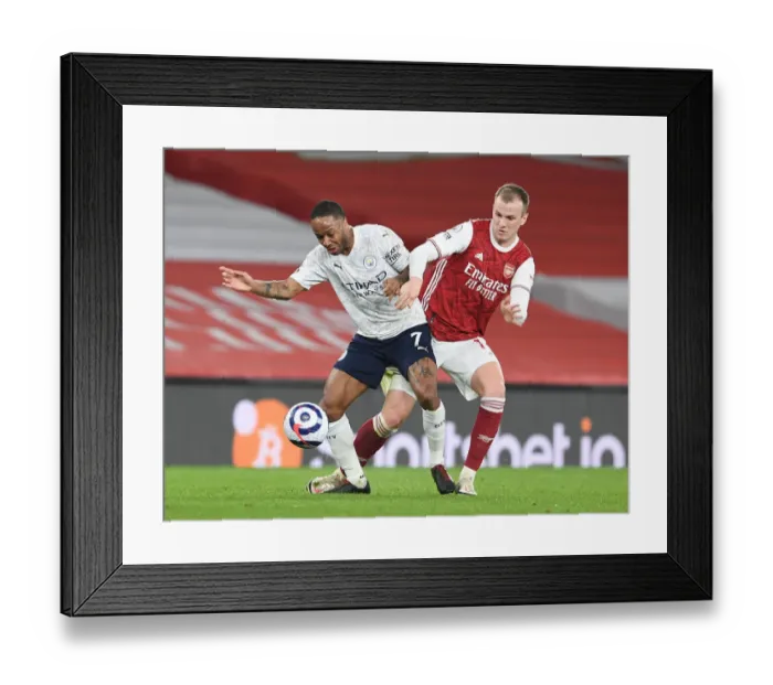 Framed Print : Rob Holding vs Raheem Sterling: A Premier League Battle in Empty Emirates Stadium During Coronavirus Restrictions