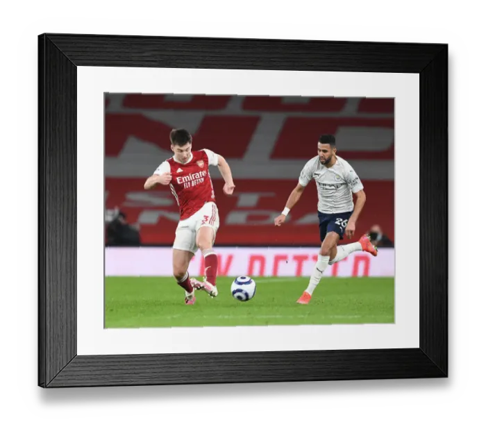 Framed Print : Arsenal's Kieran Tierney Outmaneuvers Manchester City's Riyad Mahrez in Empty Emirates Stadium Framed Print : Arsenal's Kieran Tierney Outmaneuvers Manchester City's Riyad Mahrez in Empty Emirates Stadium
