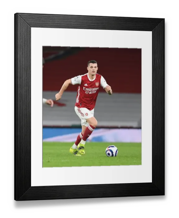 Framed Print : Granit Xhaka in Action: Arsenal vs. Manchester City - Premier League 2021 (Behind Closed Doors) Framed Print : Granit Xhaka in Action: Arsenal vs. Manchester City - Premier League 2021 (Behind Closed Doors)