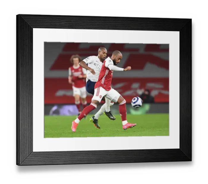 Framed Print : Arsenal vs Manchester City: Lacazette vs Fernandinho - Battle at Empty Emirates Stadium (February 2021)