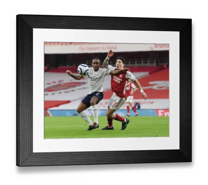 Framed Print : Empty Battle: Arsenal's Hector Bellerin vs Manchester City's Raheem Sterling in a Coronavirus-Restricted Premier League Clash