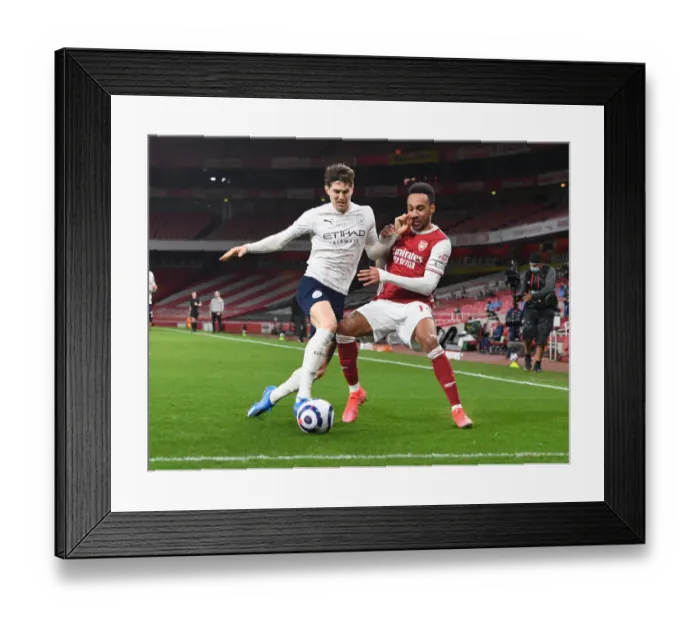 Framed Print : Empty Battle: Aubameyang vs Stones in Arsenal's Silent Showdown with Manchester City, Premier League 2020-21