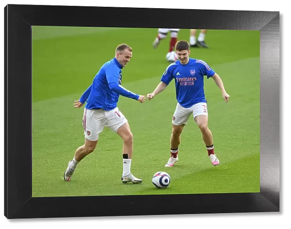 Arsenal Players Kieran Tierney and Rob Holding Warm Up Ahead of Emirates Showdown: Arsenal vs Manchester City (Behind Closed Doors), 2021