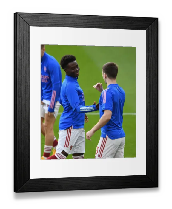 Framed Print : Arsenal Players Kieran Tierney and Bukayo Saka Warm Up Ahead of Emirates Showdown: Arsenal vs Manchester City (2021-22 Premier League) Framed Print : Arsenal Players Kieran Tierney and Bukayo Saka Warm Up Ahead of Emirates Showdown: Arsenal vs Manchester City (2021-22 Premier League)