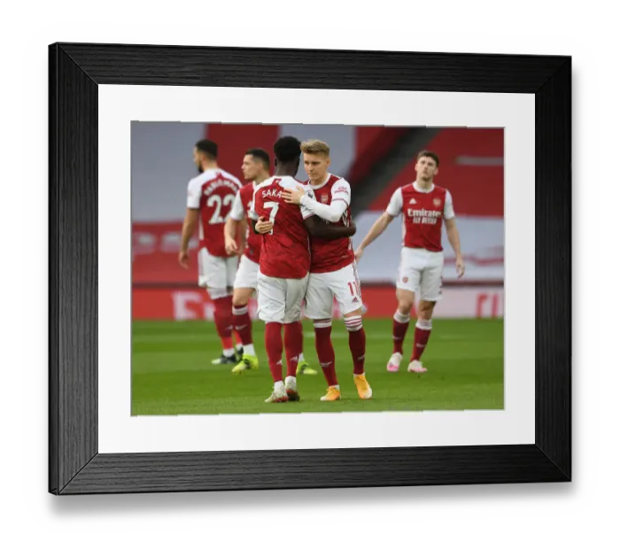 Framed Print : Arsenal's Embrace: Saka and Odegaard Unite Amidst Empty Emirates Stadium (Arsenal v Manchester City, 2021) Framed Print : Arsenal's Embrace: Saka and Odegaard Unite Amidst Empty Emirates Stadium (Arsenal v Manchester City, 2021)