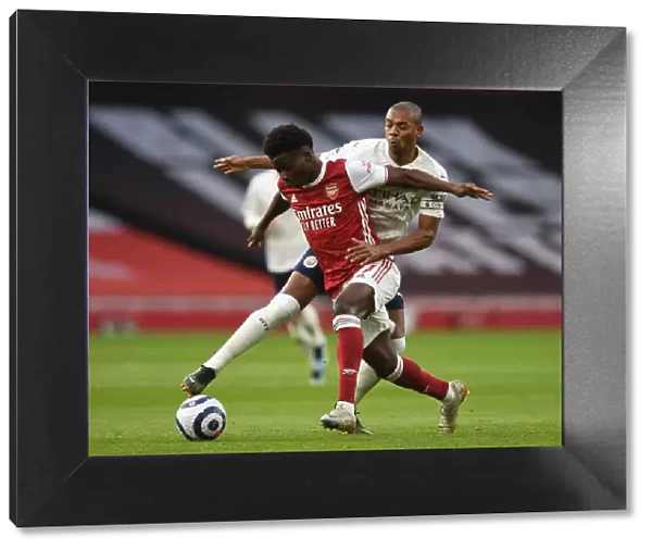 Arsenal vs Manchester City: Bukayo Saka Clashes with Fernandinho in Empty Emirates Stadium