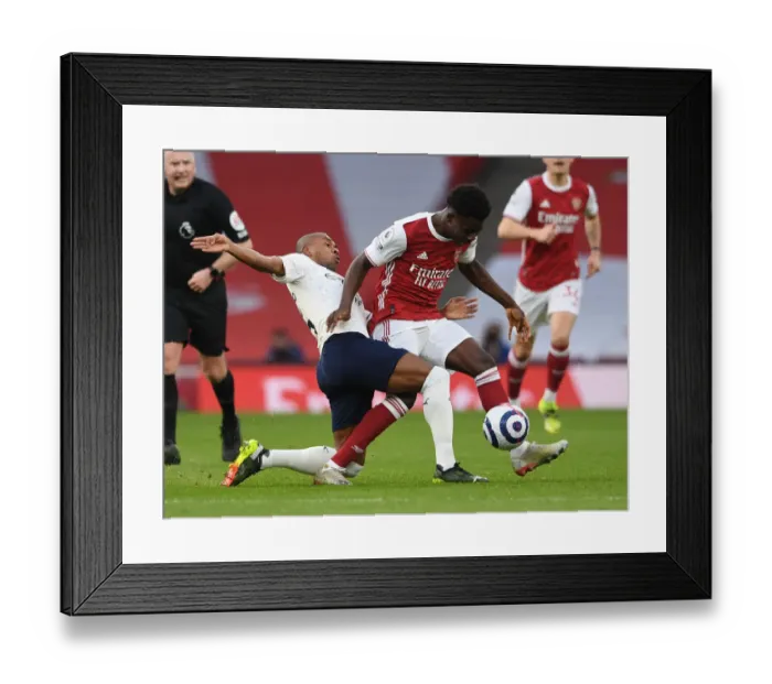 Framed Print : Clash of Titans: Bukayo Saka vs Fernandinho - Arsenal vs Manchester City, Premier League 2021: A Battle in the Empty Emirates Stadium